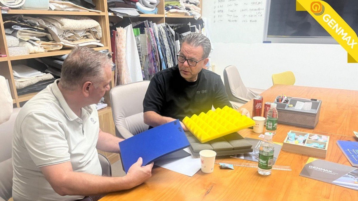 Jordanian customers engaged in detailed discussion about mattress product specifications with technical experts in the company's conference room while evaluating material samples.