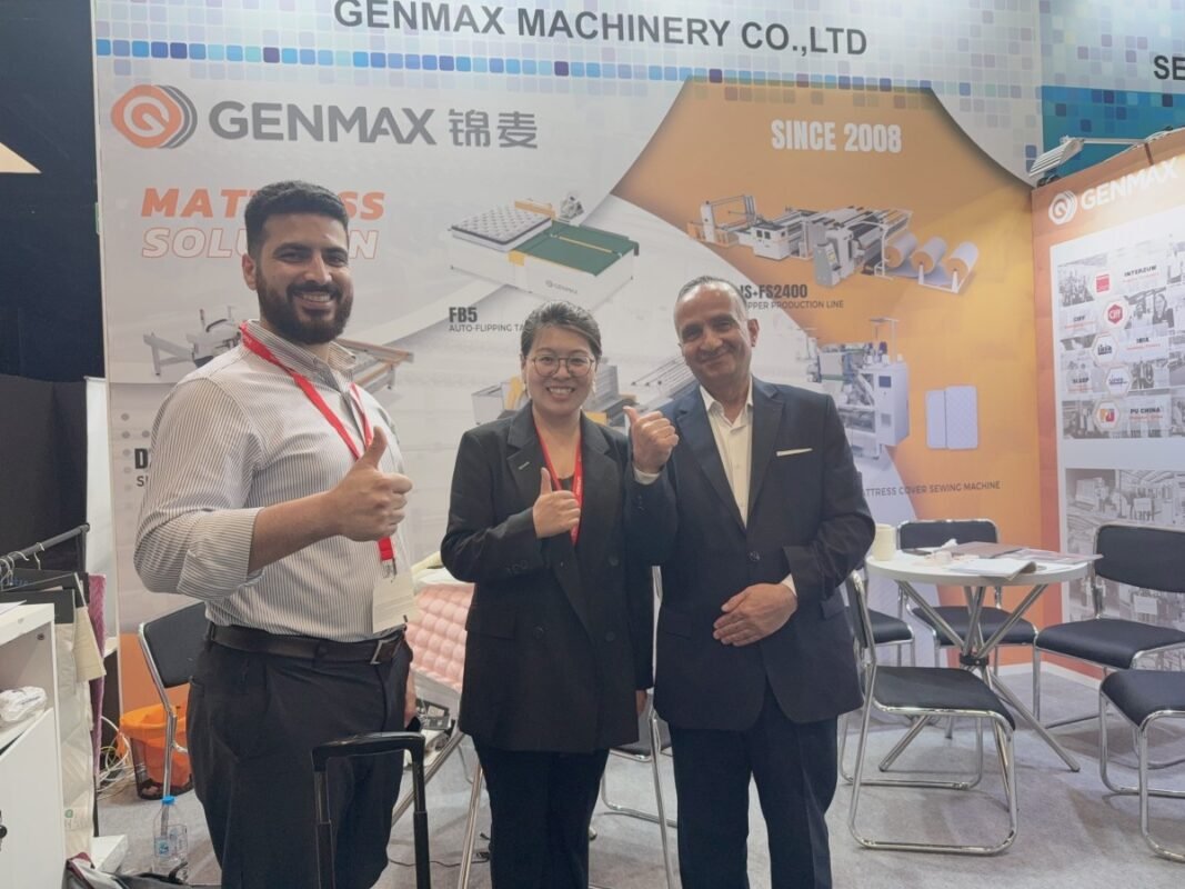 Mattress industry delegates and GENMAX technical specialists taking a commemorative group photo after finalizing equipment specifications at Interzum 2025.